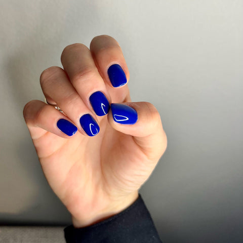 hand-with-blue-nails